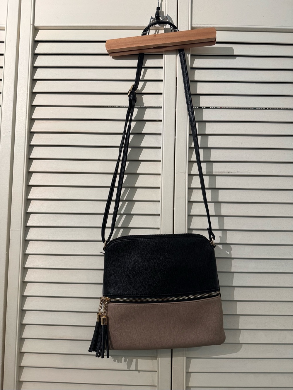 Two-Tone Black and Taupe Crossbody Bag with Tassel
